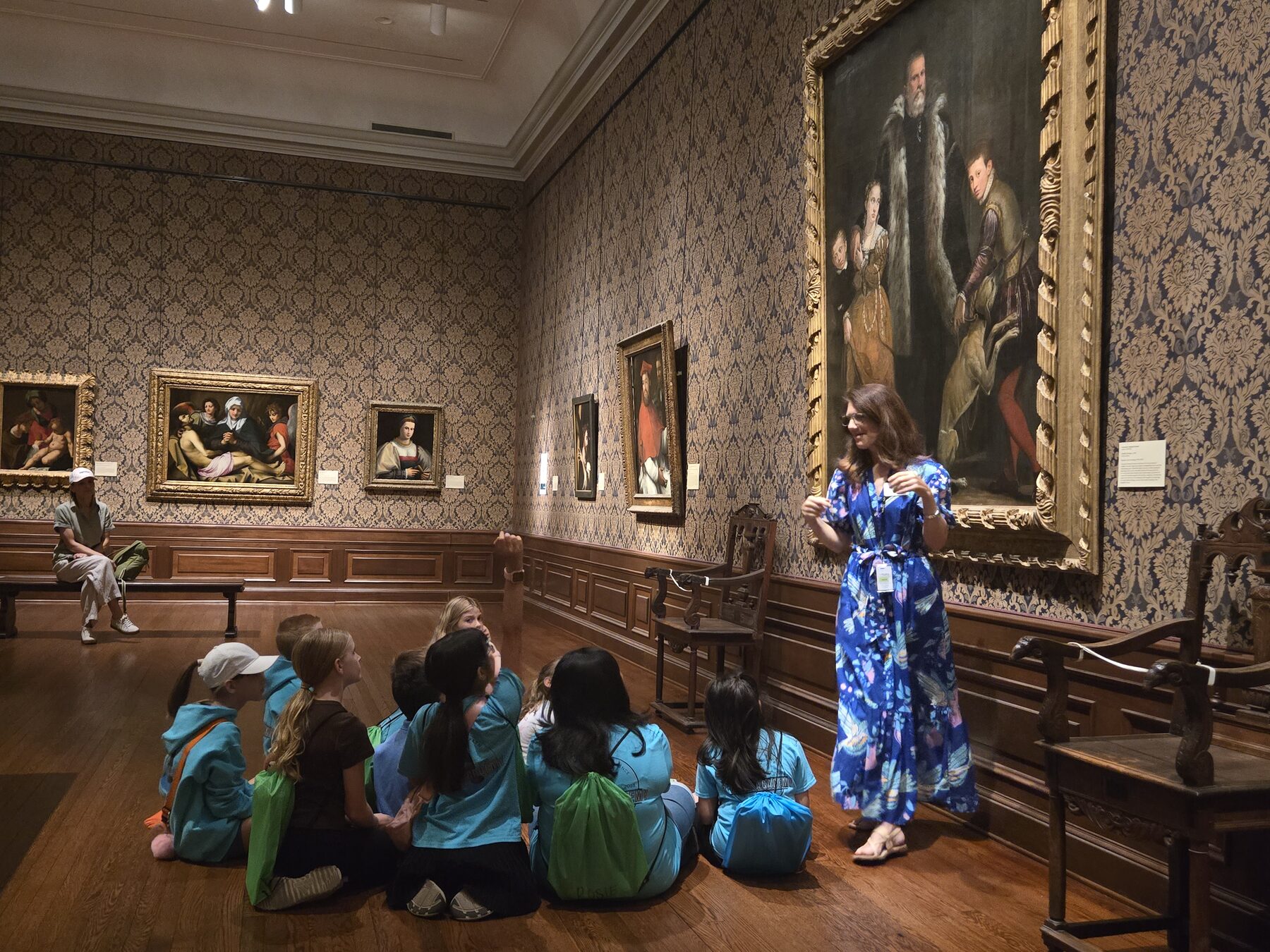 A 3 Oaks Academy teacher leading students on a museum gallery tour