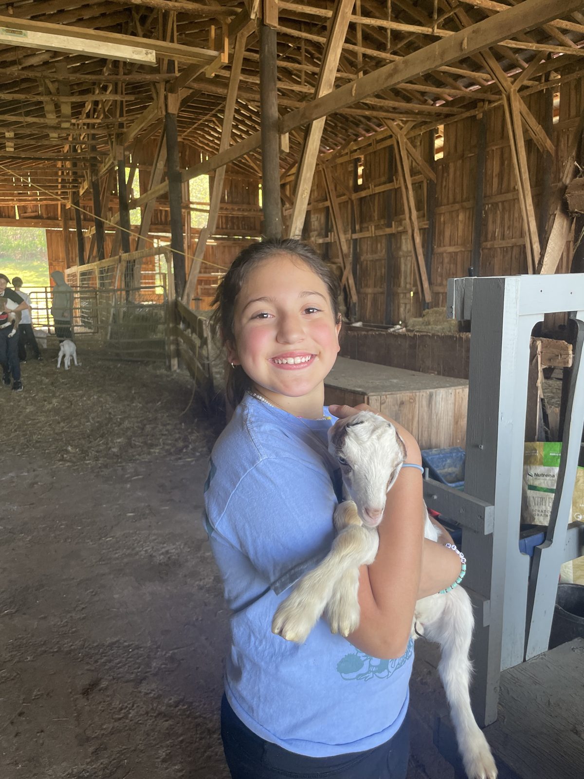 3 Oaks student with a barn animal on Week Without Walls