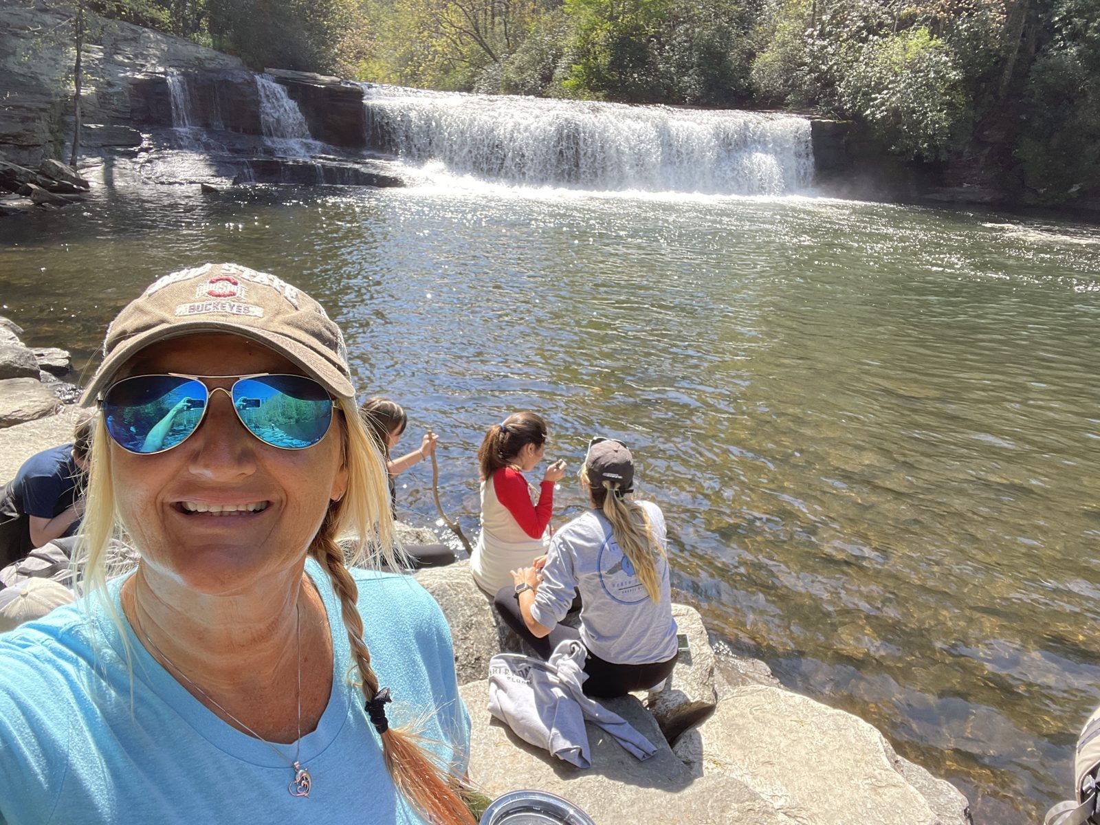 Students beside a waterfall near Asheville
