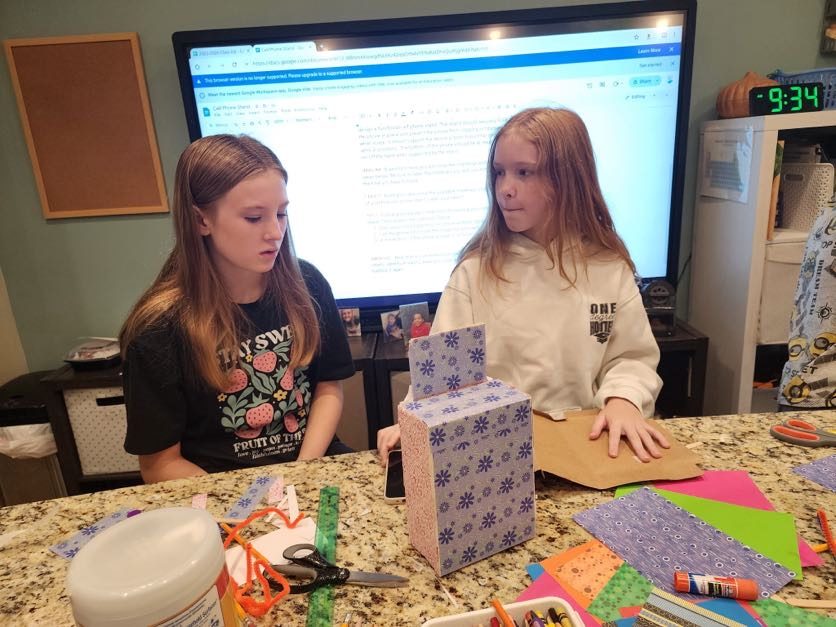 Students presenting at the classroom smartboard