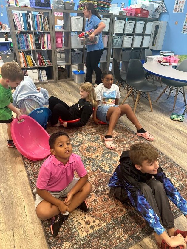 Students reading together in the library nook