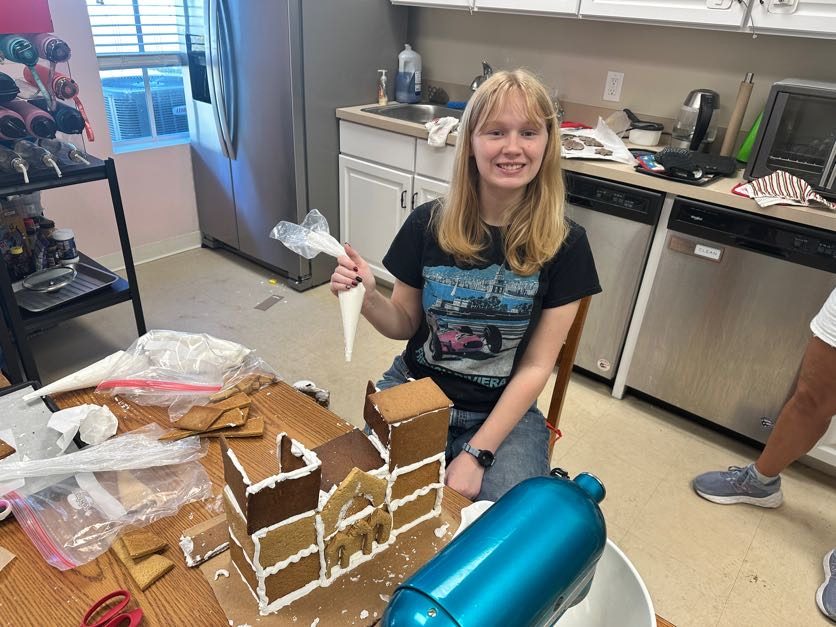 A student proud of her finished project