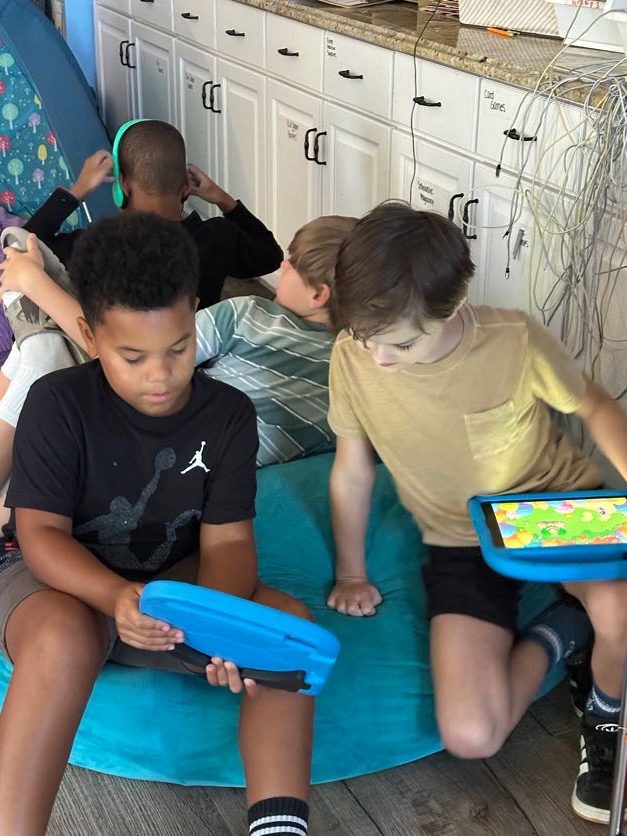 Students exploring on their tablets
