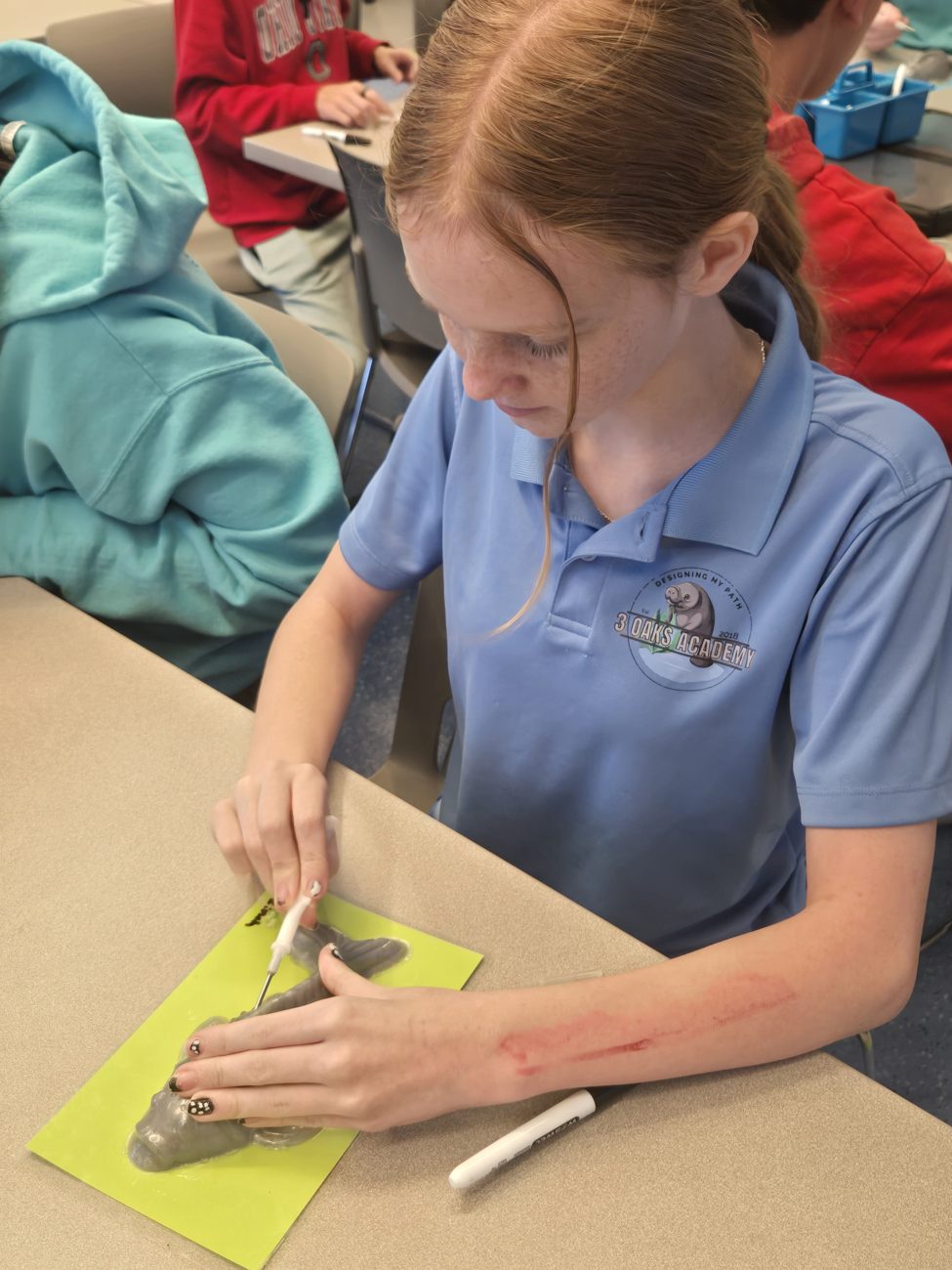 A student focused on a hands-on project