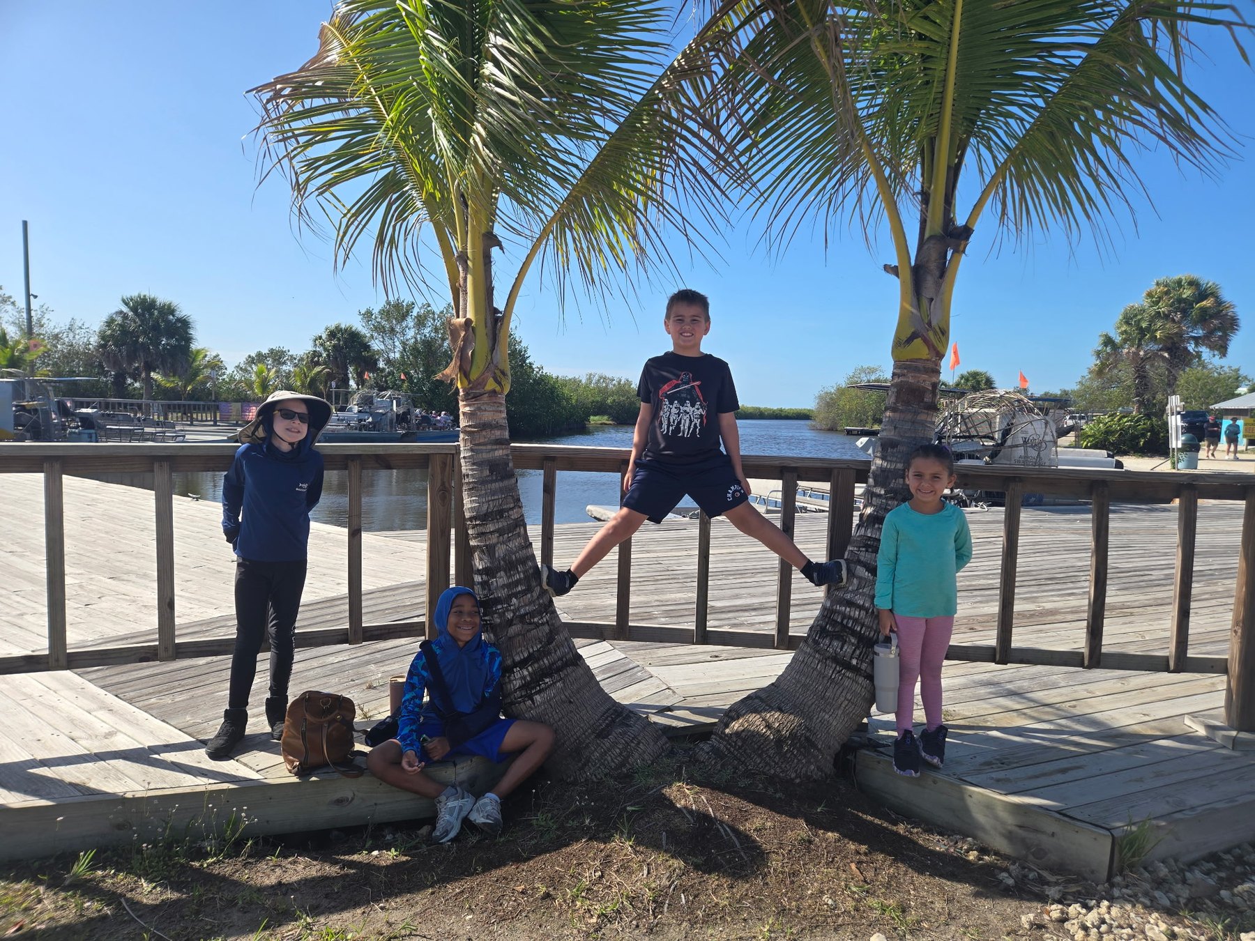 3 Oaks Academy students learning outdoors among the trees