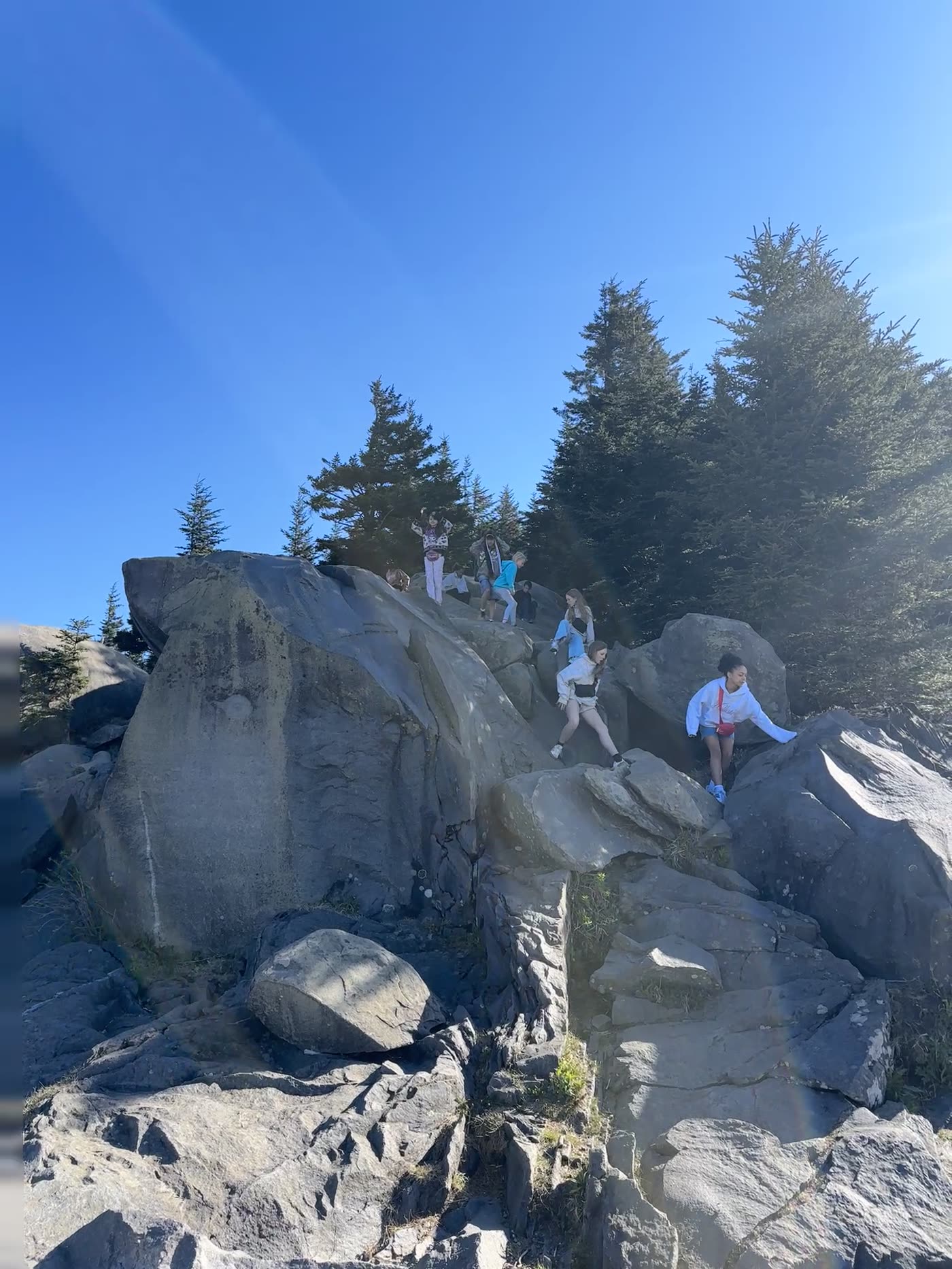 Week Without Walls — students climbing rocks on a mountain